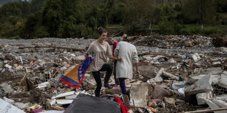 Bosnians pick up pieces after devastating flash floods kill 18