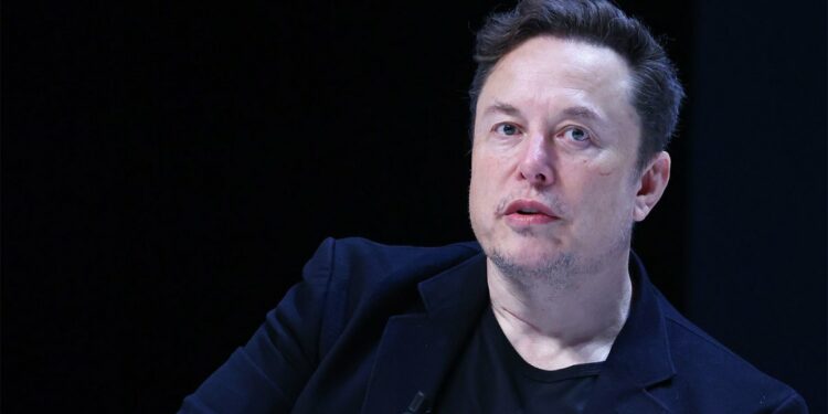 Elon Musk onstage at 'Exploring the New Frontiers of Innovation'