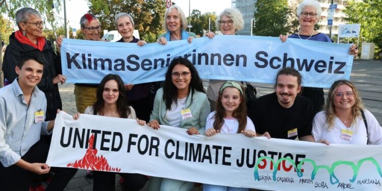 Two of the groups of plaintiffs outside the court last year