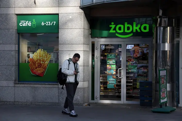 Man outside Żabka convenience store.