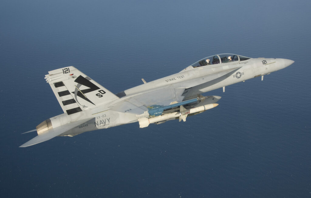 An F/A-18F Super Hornet assigned to the Salty Dogs of Air Test and Evaluation Squadron (VX) 23 conducts a captive carry flight test of an AGM-88E Advanced Anti-Radiation Guided Missile at Naval Air Station Patuxent River, Md. (U.S. Navy photo by: Greg L. Davis)