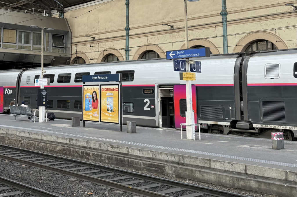 The TGV Duplex rail cars are ready for boarding on the French platform.