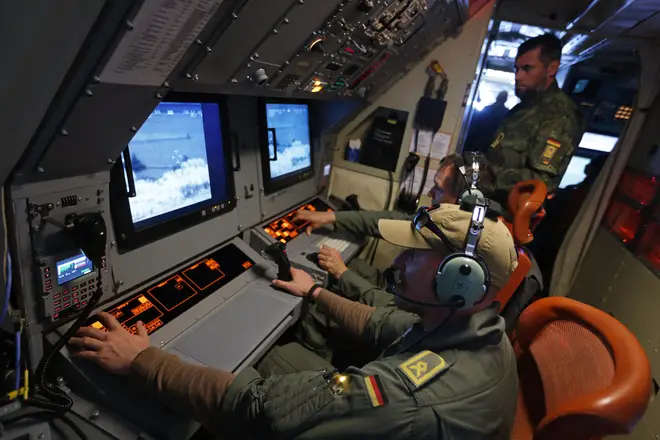 Crew members aboard a P-3C Orion anti-submarine and maritime surveillance plane of the German Navy