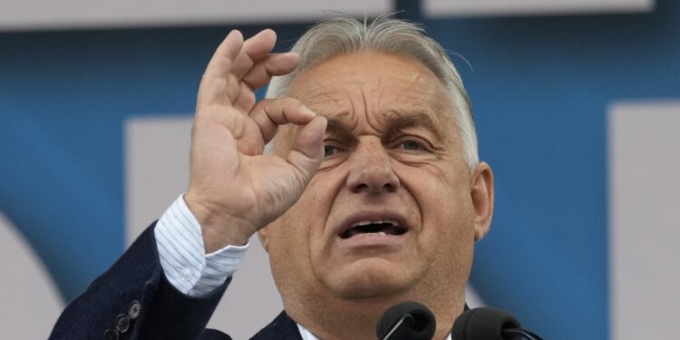 Hungary’s Orbán interrupted by activist during EU presidency news conference