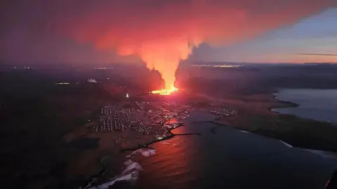 Reuters A volcano spews lava and smoke as it erupts in Reykjanes Peninsula