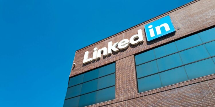 View of main building with logo and signage at the headquarters of professional social networking company LinkedIn