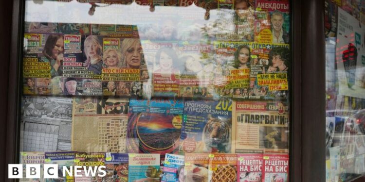 Russian language magazines are seen in the window of a newspaper stand, on May 3, 2022 in Chisinau, Moldova