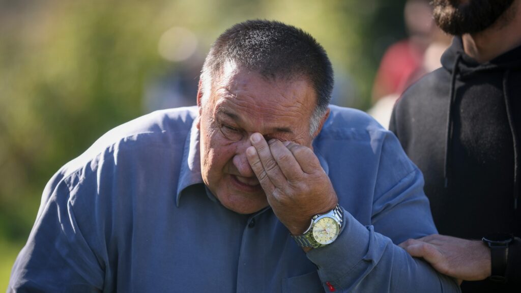 Several thousand attend a funeral service in southern Bosnia for 19 killed in devastating floods