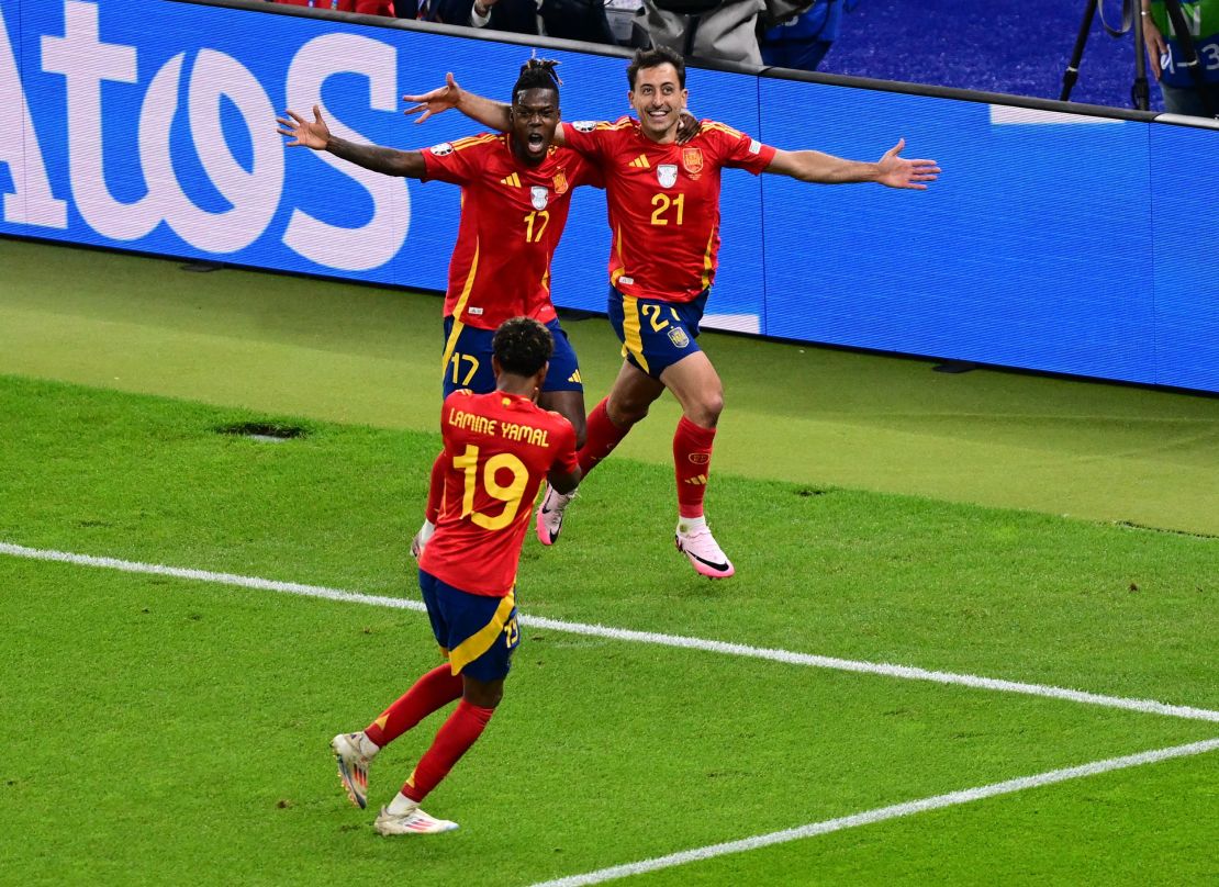 Spain's Mikel Oyarzabal (right) celebrates scoring the winning goal against England.