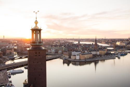 A city with a river and a bridge

Description automatically generated