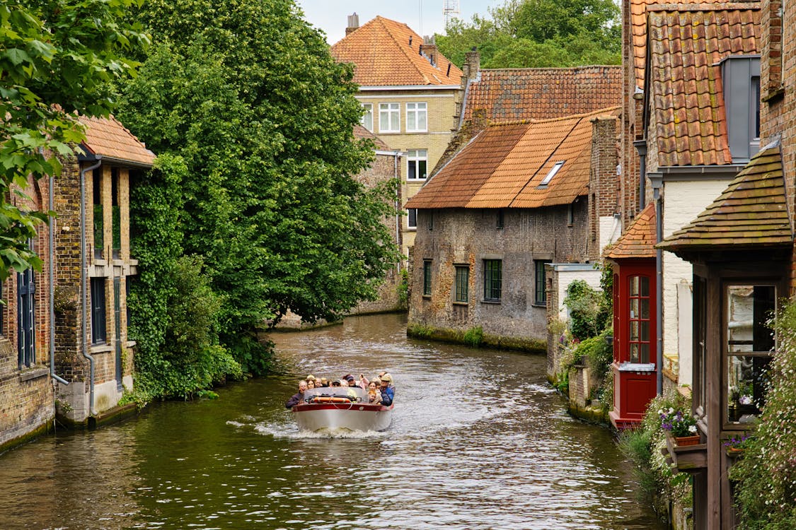 Tourists on Motorboat on Canal in Bruges, Belgium