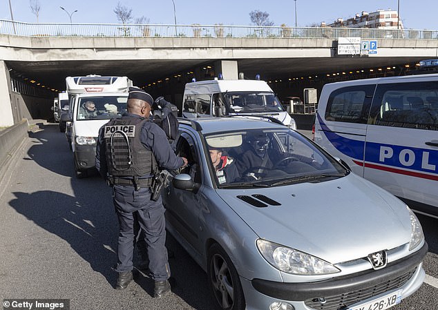 A French police officer stops a car in Paris. A French government statement declared the checks will be introduced due to 'serious threats to public policy, public order, and internal security posed by high-level terrorist activities'