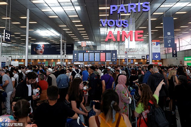 Passengers forming a large queue in Paris' Orly Airport. Tourists could face travel chaos in France after the country became the latest EU member to tighten its border controls