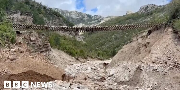 Train track left hanging in the air after Bosnia landslides