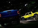 The 2024 Jeep Gladiator Mojave truck, left, and 2024 Jeep Gladiator Rubicon truck during the 2023 North American International Auto Show in Detroit.