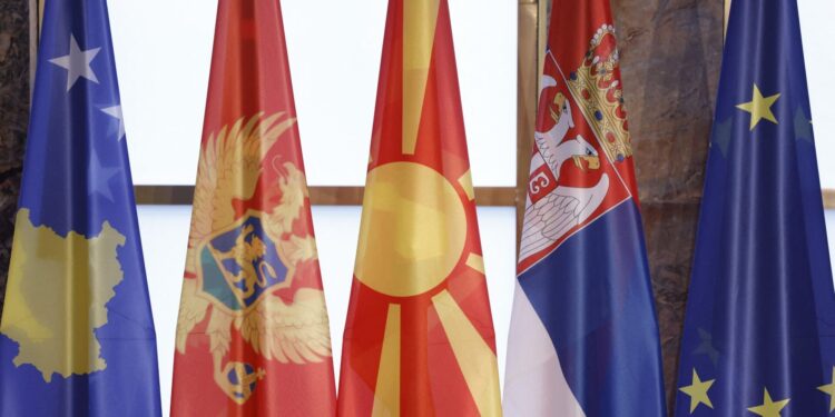 The national flags of (L-R) Kosovo, Montenegro’s North Macedonia, Serbia, and the European Union are set up on a stage for a group photo during the Western Balkans Summit at the Federal Foreign Office in Berlin, Germany, on 21 October 2022