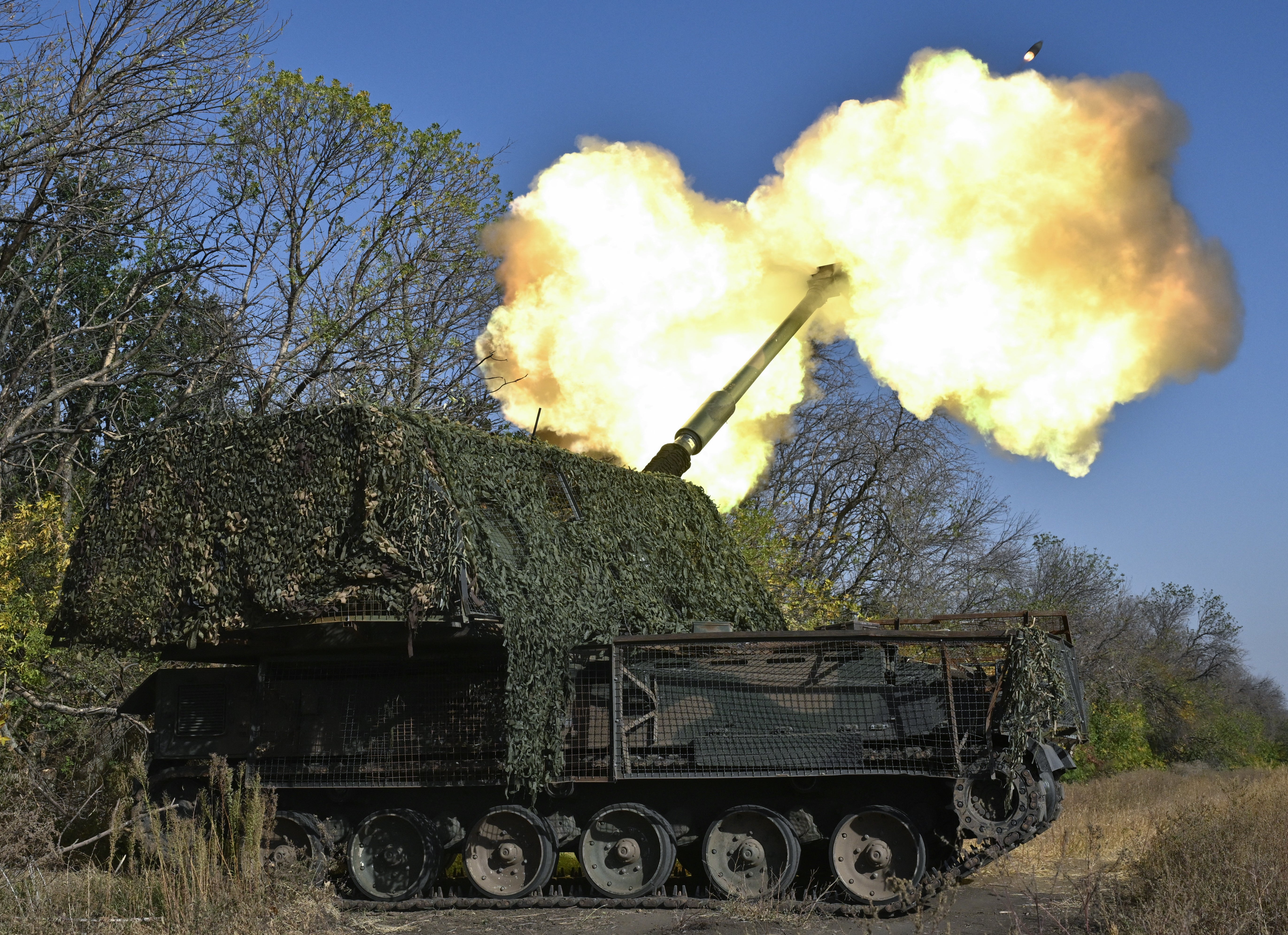 Ukrainian servicemen of the 26th artillery brigade fire an AHS Krab self-propelled howitzer toward Russian positions near the front line in the Chasiv Yar area in the Donetsk region