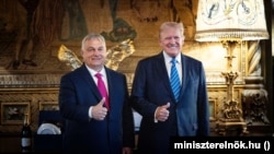 Hungarian Prime Minister Viktor Orban (left) meets with former U.S. President Donald Trump, the Republican nominee in the November 5 U.S. presidential election, at Trump's Mar-a-Lago residence in Palm Beach, Florida, in July.