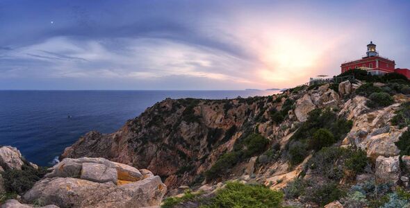 Panoramic view of the lighthouse of Capo Spartivento at sunset