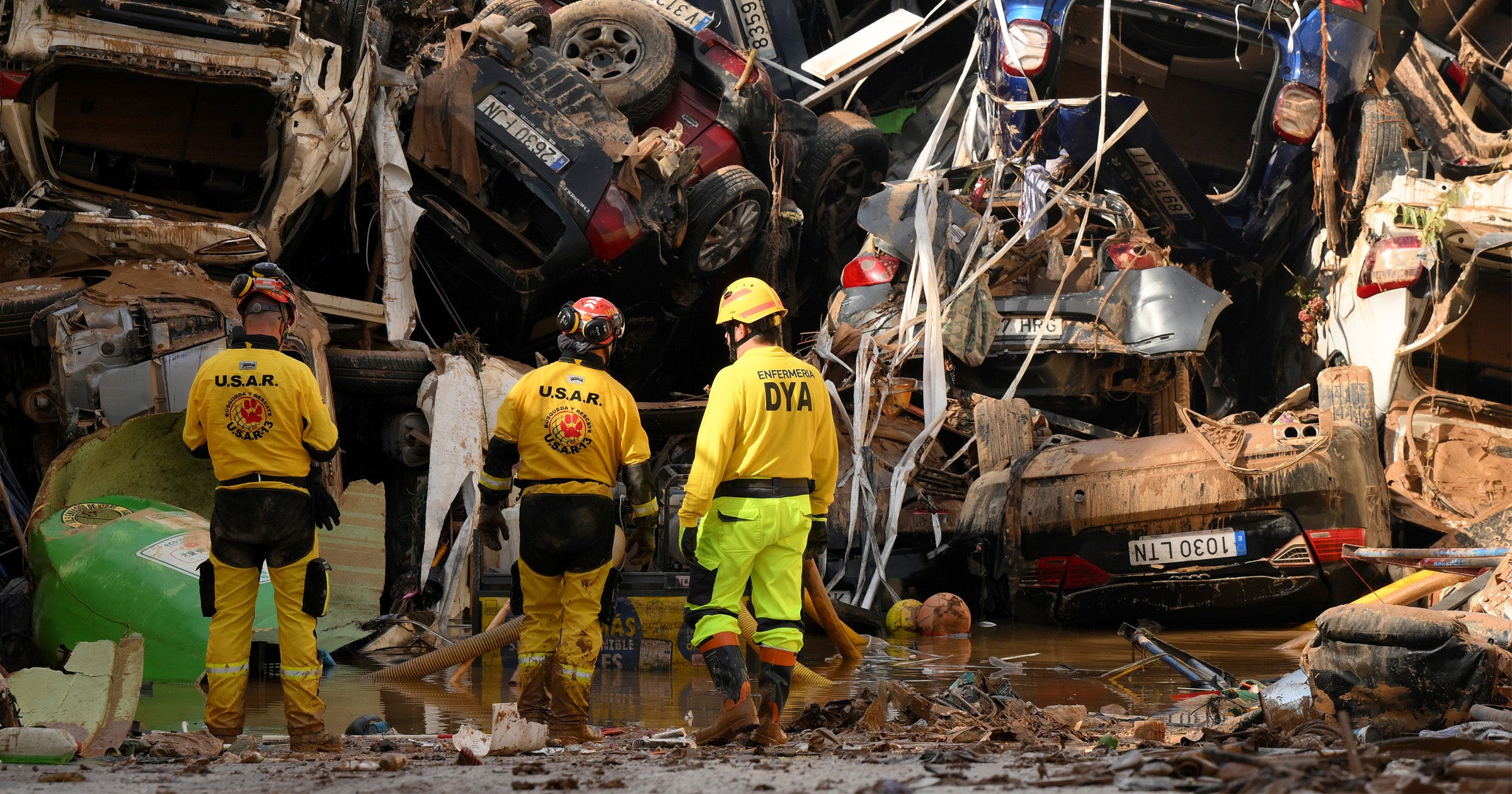 Members of the fire brigade, which are part of a search and rescue unit, carry out work