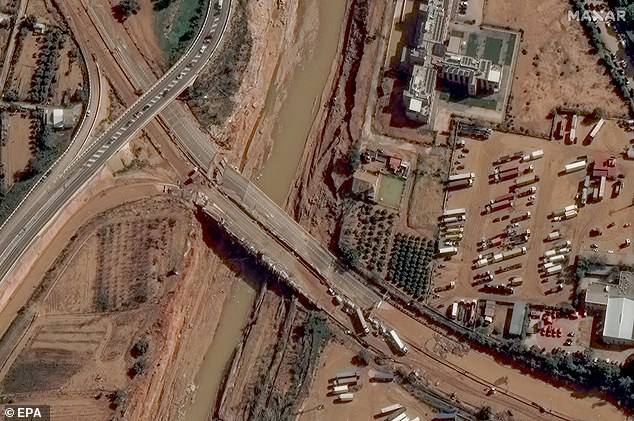 A handout satellite image made available by Maxar Technologies shows a damaged section of the CV33 highway after torrential rains in Spain's eastern province of Valencia, 31 October 2024