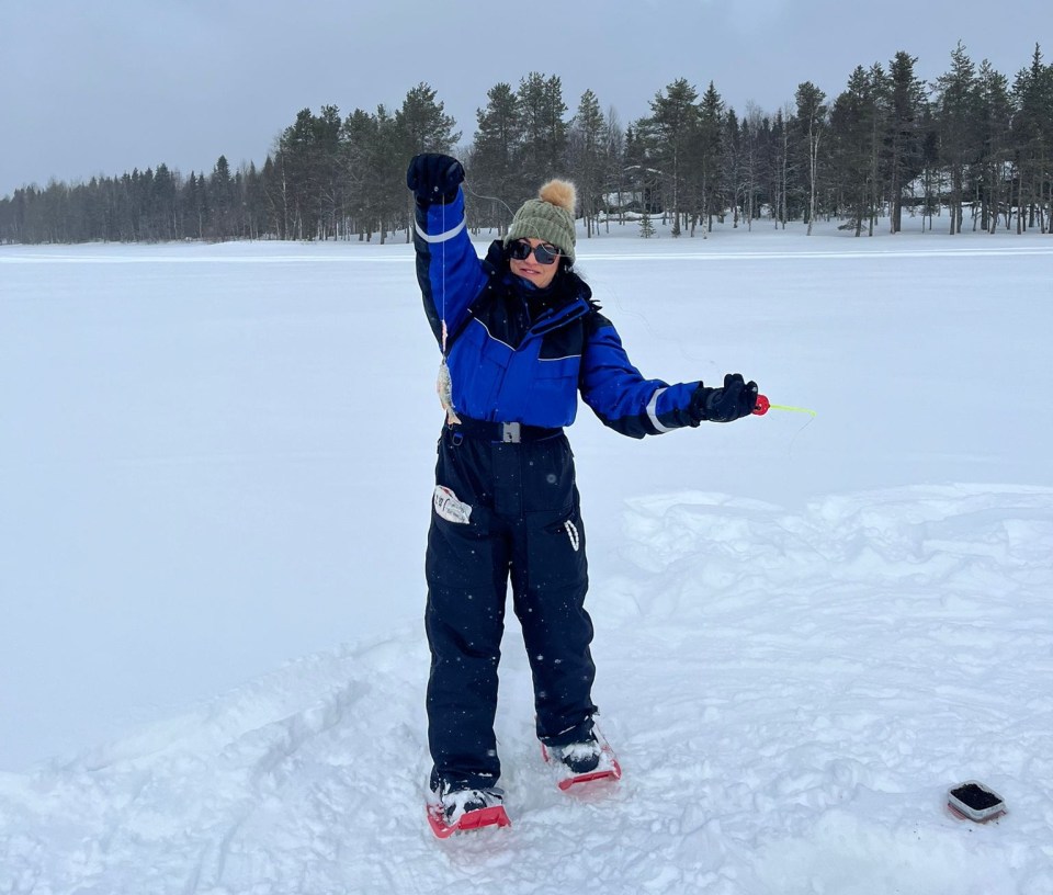 The Sun 's Felicity Cross uses an auger on ice