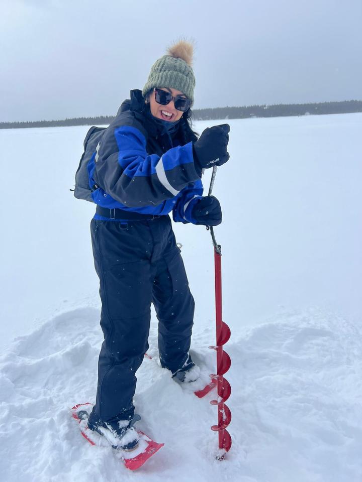 Felicity catches a fish in the ice