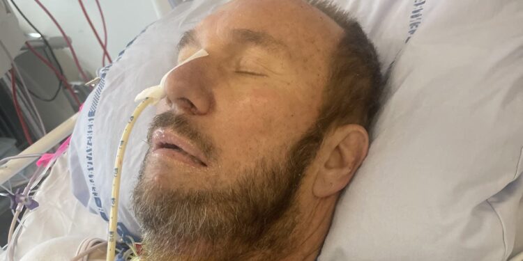 Father returns home after weeks in European hospital following severe illness on vacation