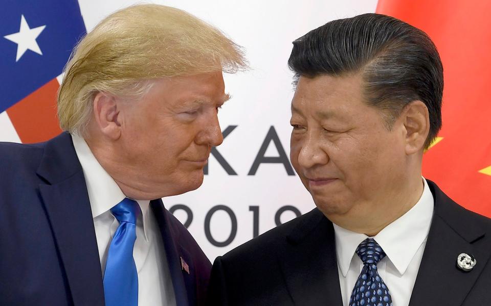 Donald Trump pictured here in 2019 with Xi Jinping, the Chinese president, has vowed to hit Beijing with 60 per cent tariffs