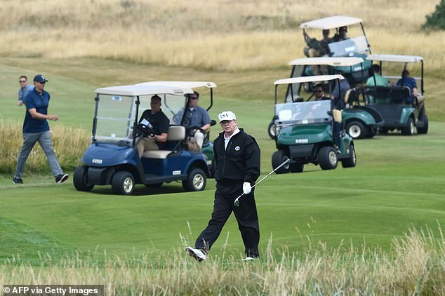 Pictured: Trump is seen playing a round of golf during a visit to Scotland in 2018. He spent two days at course while in office, meeting the then-Prime Minister Theresa May and the late Queen during the visit