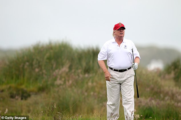 Donald Trump plays a round of golf after the opening of The Trump International Golf Links Course in Aberdeen on July 10, 2012