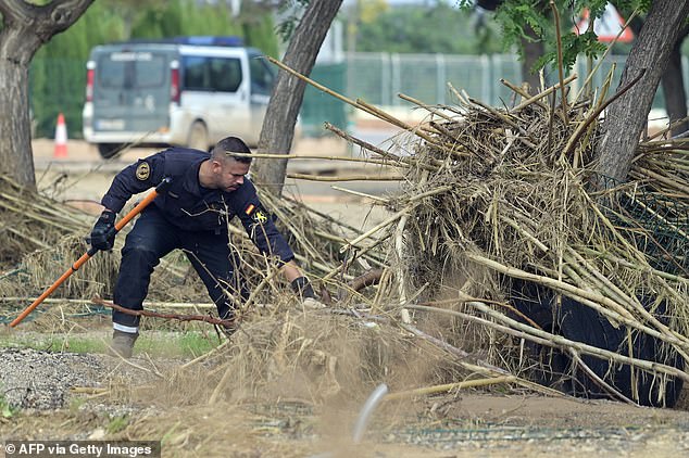 A civil guard searches for victims in Cheste, region of Valencia, eastern Spain on November 8