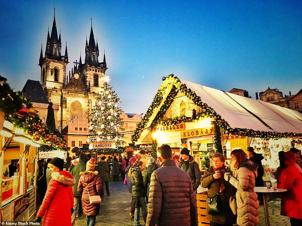 Get set for Christmas: Prague is one of the festive destinations where your money is said to stretch furthest. Above, stalls fill the city's Old Town Square