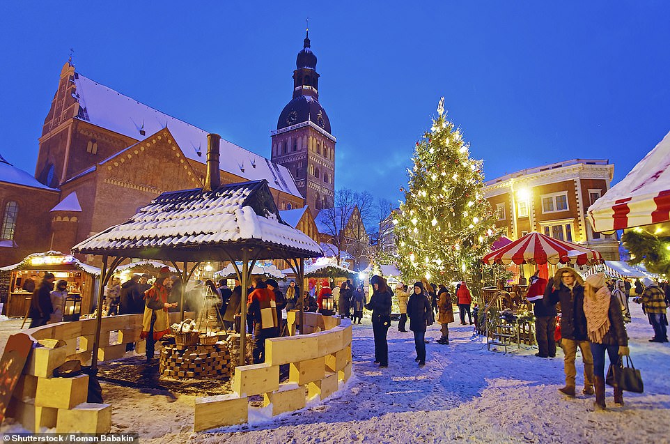 Above, festive stalls set out in Doma Square in Riga, Latvia's capital