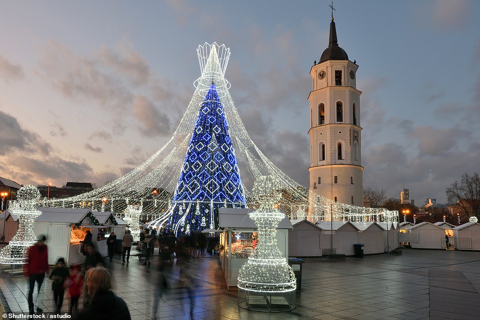 Vilnius, Lithuania, is the second-cheapest destination for a festive getaway. Above, Vilnius's Christmas market in Cathedral Square
