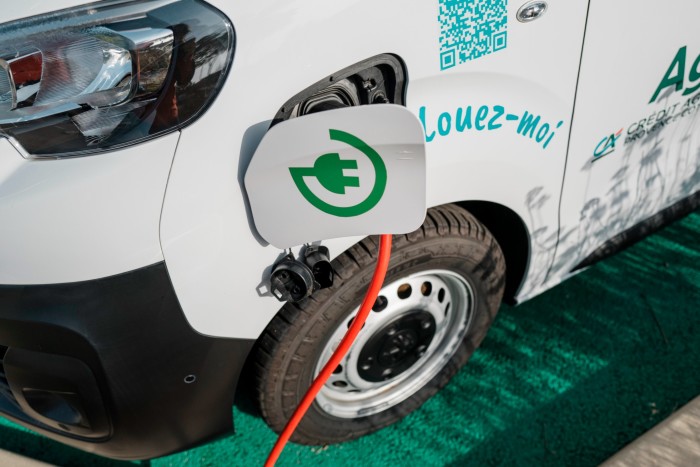 An AgilAuto electric van is being recharged before its next use in Montauroux