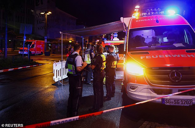 The new rules were brought forward by the government in August in response to a deadly stabbing at a festival in the western city of Solingen. Image shows police officers securing the area of the Solingen attacks after a man randomly stabbed passers-by with a knife