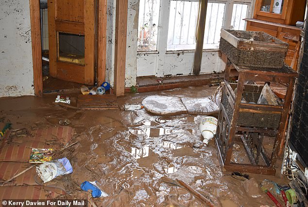 Collect pictures of the immediate aftermath of the Valencia flood on the home of Mari the Mother of David Fraile in the nearby town of Cheste