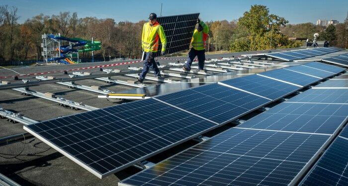 Workers assemble a photovoltaic power plant in the Czech Republic