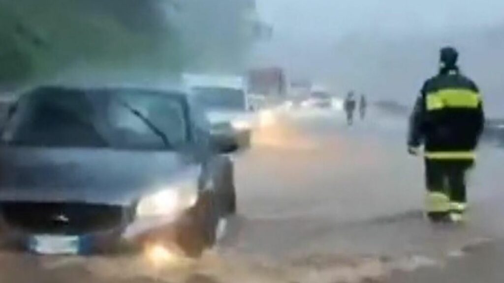 Firefighters rescue drivers in Italy from torrential floods