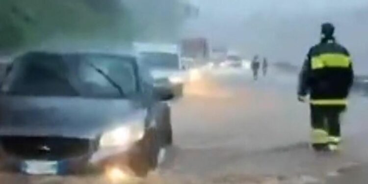 Firefighters rescue drivers in Italy from torrential floods