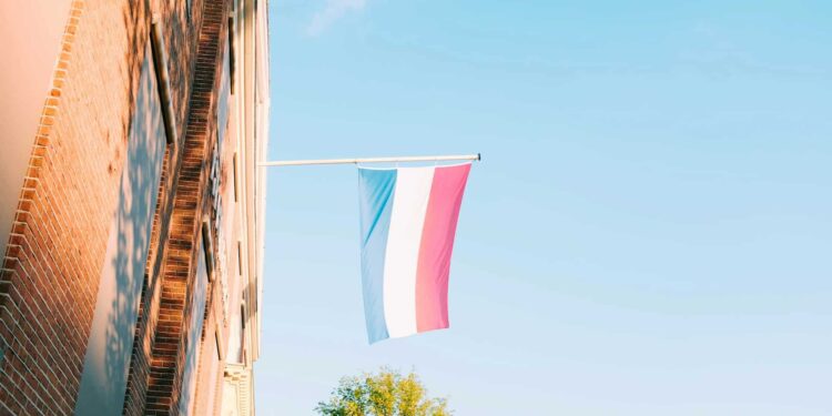 The Netherlands flag against the sky.