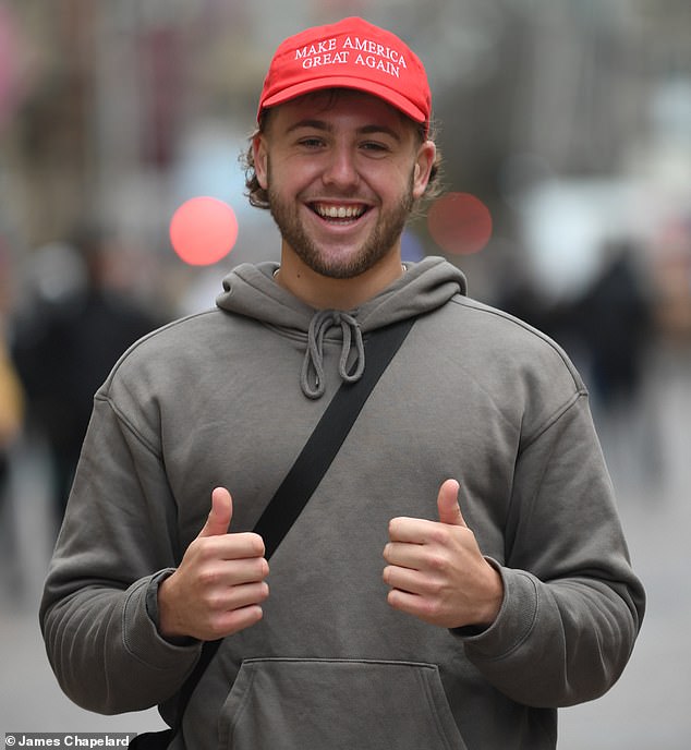 Kieon Lategam-Urquhart, 20, celebrating the Trump victory while wearing his 'Make America Great Again' cap