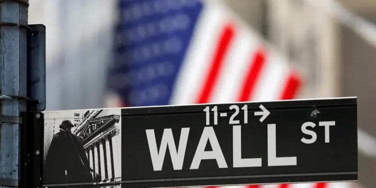 Wall Street sign with American flag background