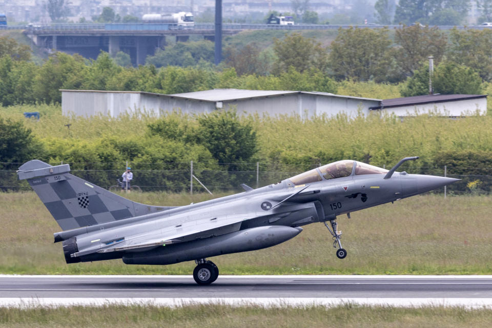 A photograph taken on April 25, 2024 shows a Rafale fighter jet landing during the arrival ceremony for the first batch of the jets purchased from France, in Zagreb, Croatia. Croatia received the first six of a dozen used French fighter jets after the warplanes touched down in the capital Zagreb. Croatia purchased the Rafale jets as part of a major overall of its air force, with the planes replacing a fleet of ageing Russian-made MiGs. (Photo by DAMIR SENCAR / AFP) (Photo by DAMIR SENCAR/AFP via Getty Images)