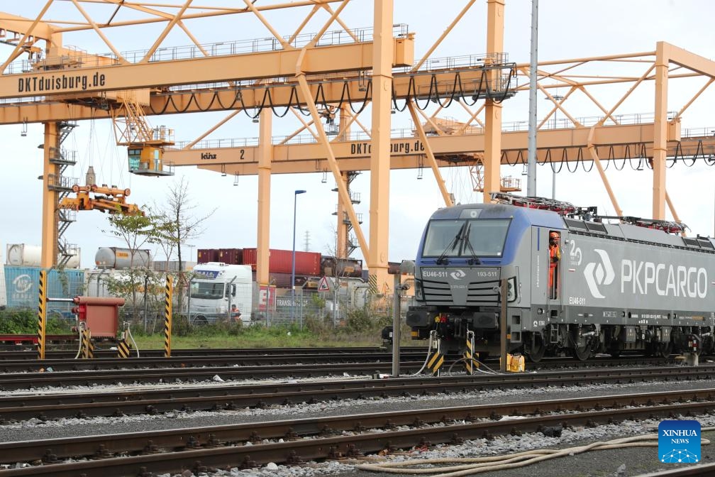 This photo taken on Dec. 3, 2024 shows the 100,000th China-Europe freight train at Duisburg Intermodal Terminal (DIT) in Duisburg, Germany. The 100,000th China-Europe freight train arrived in Duisburg, Germany on Tuesday morning, marking a historic milestone for this rail link. The train, X8083, which had departed from Chongqing, China, arrived at Duisburg's terminal at 9:10 a.m. local time, carrying electronics, industrial parts, and household appliances. The train's cargo was quickly unloaded for distribution to various destinations across Europe. (Photo: Xinhua)