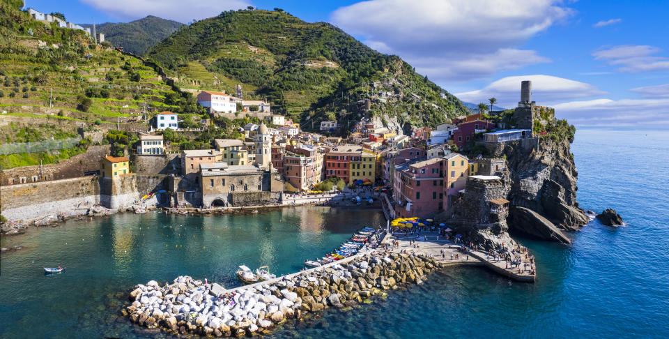 Italy, Cinque terre  national park in Liguria.  traditional fishing village  Vernazza. Aerial panorama with  colorful houses and picturesque bay. popular tourist attraction