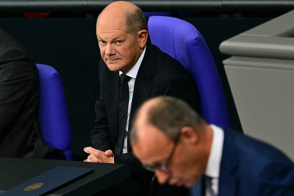 In Germany, Chancellor Olaf Scholz and his conservative rival Friedrich Merz clash over military aid to Ukraine