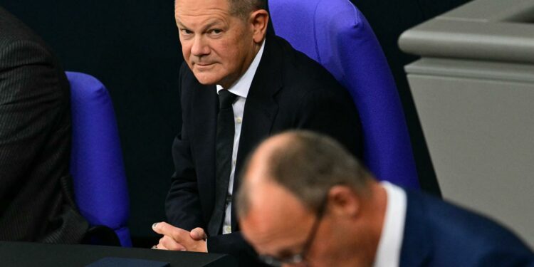 In Germany, Chancellor Olaf Scholz and his conservative rival Friedrich Merz clash over military aid to Ukraine