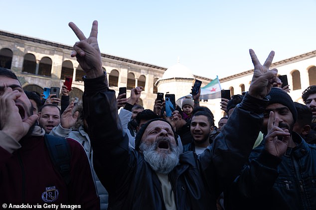 People gather the mosque and its surroundings with 'Syrian revolution flag' and chant slogans calling for the country's freedom and a 'new Syria'